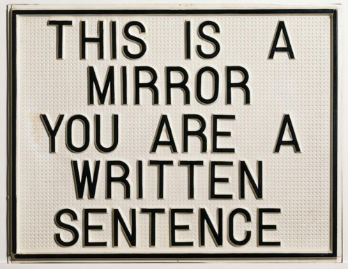 mirror written sentence (Luis Camnitzer)
